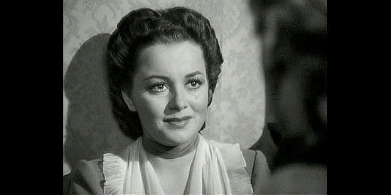 Olivia de Havilland as Elizabeth Custer, tears in her eyes as she says goodbye to her husband in They Died with Their Boots On (1941)