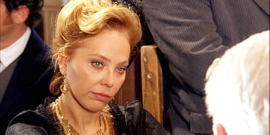 Ornella Muti as Debra 'Tricky' Downing, a former flame of the sheriff, drawn to Holy Sands by the poker tournament in Triggerman (2009)