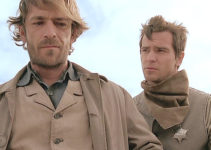 Daniel Wisner as Hank (right), a deputy warning Matt Austin about a road of revenge in The Pledge (2008)