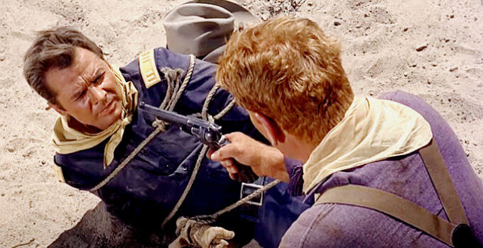 Audie Murphy as Capt. Coburn, under the gun of one of his own men in 40 Guns to Apache Pass (1967)