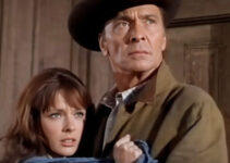 Barry Sullivan as Benjamin Pride, protecting daughter Midge (Brenda Scott) when Barker''s Raiders come calling in This Savage Land (1969)