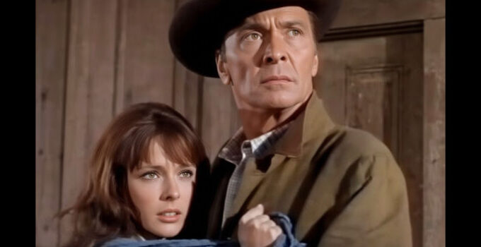 Barry Sullivan as Benjamin Pride, protecting daughter Midge (Brenda Scott) when Barker''s Raiders come calling in This Savage Land (1969)