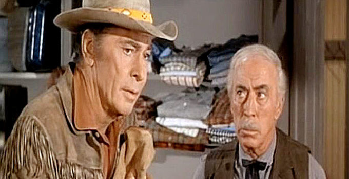 Barry Sullivan as Chaddock, remembering his late wife as store owner Perkins (George Chandler) look son in Buckskin (1968)