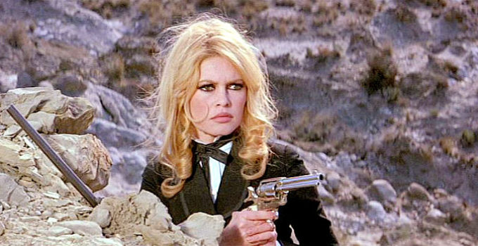 Brigitte Bardot as Irina Lazaar, ready to defend herself in Shalako (1968)