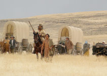 Bruce Greenwood as Stephen Meek and Rob Rondeaux as the Indian lead the way for the wagons in Meek's Cutoff (2010)