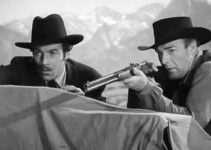 Cesar Romero as Doc Halliday and Randolph Scott as Wyatt Earp, trying to chase off bandits in Frontier Marshal (1939)