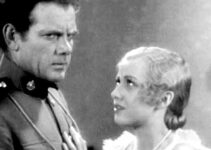 Charles Bickford as John Keith with Mirium McDowell, trying to decide whether to reveal the truth about his identity in River's End (1930)