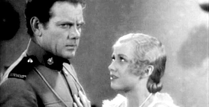 Charles Bickford as John Keith with Mirium McDowell, trying to decide whether to reveal the truth about his identity in River's End (1930)