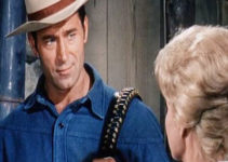 Clint Walker as Big Jim Cole ready to swap his old badge and six-gun for a loan for his ranch in The Night of the Grizzly (1966)