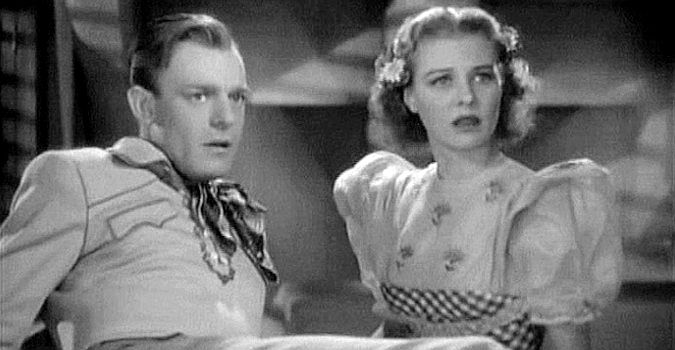 Dennis O'Keefe as 'Wild Bill' Malone and Florence Rice as Margo Thomas, reacting to an engagement announcement in The Kid from Texas (1939)