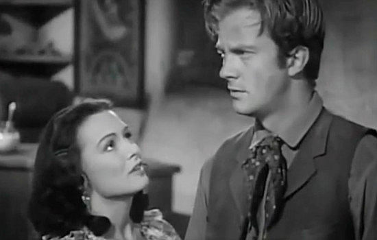 Donna Reed as Rosalia Martinez trying to keep Tom Folliard (William Lundigan) from making a decision he'll regret in Apache Trail (1942)