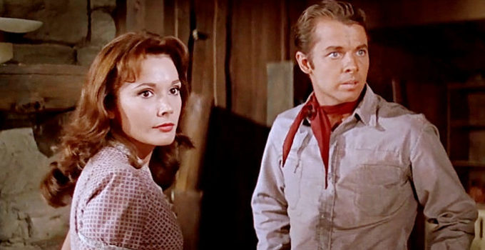 Felicia Farr as Janet and Audie Murphy as Clay Santell, reacing to unexpeced visitors in Hell Bent for Leather (1960)
