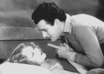 GIlbert Roland as Louis La Bey, caring for Nedra Ruskin (Barbara Leonard) after she's been buried by an avalanche in Men of the North (1930)