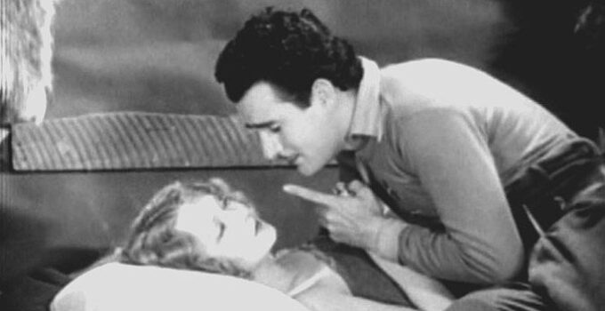 GIlbert Roland as Louis La Bey, caring for Nedra Ruskin (Barbara Leonard) after she's been buried by an avalanche in Men of the North (1930)