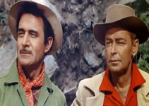 Gilbert Roland as Monty Walker and Alan Ladd as Jim Hadley in Guns of the Timberland (1960)