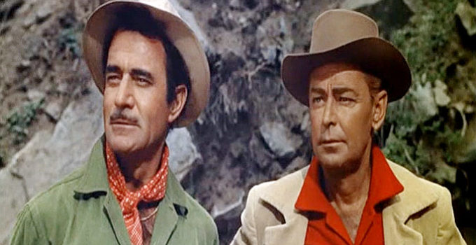Gilbert Roland as Monty Walker and Alan Ladd as Jim Hadley in Guns of the Timberland (1960)