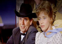 Glenn Ford as Yancey Cravet and Maria Schell as his wife Sabra in Cimarron (1960)