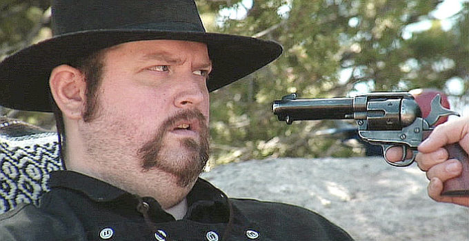 PROMO -- Jeremy Owen as Leonard Cross, under a fellow gang member's pistol in The Righteous and the Wicked (2010)