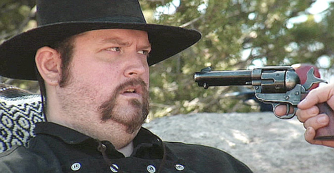 PROMO -- Jeremy Owen as Leonard Cross, under a fellow gang member's pistol in The Righteous and the Wicked (2010)