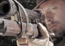 Jim Hilton as WIll Drayton, taking aim with his sharp-shooting rifle in All Hell Broke Loose (2009)