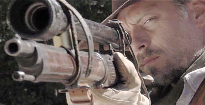 Jim Hilton as WIll Drayton, taking aim with his sharp-shooting rifle in All Hell Broke Loose (2009)