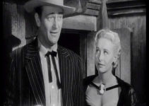 John Wayne as John Devlin and Vera Ralston as his new bride Sandy in Dakota (1945)