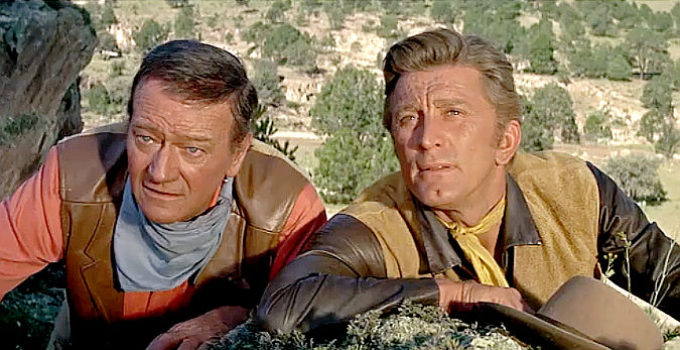 John Wayne as Taw Jackson and Kirk Douglas as Lomax in The War Wagon (1967)