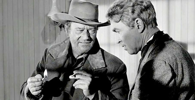 John Wayne as Tom Doniphon, sharing a secret about the night an outlaw died with Ransom Stoddard (James Stewart) in The Man Who Shot Liberty Valance (1962)