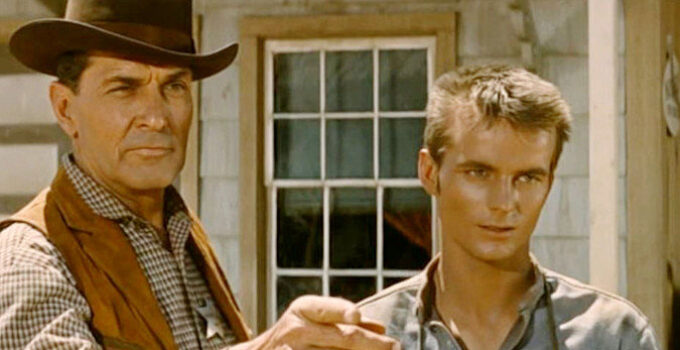 Kent Taylor as Marshal Jim Cogan, ready to arrest Billy (Gary Snead) on a minor charge in The Broken Land (1962)