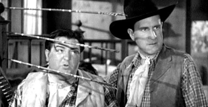 Lou Costello as Willoughby, feigning bravery in the face of Indian threats with buddy Duke (Bud Abbott) in Ride 'Em Cowboy (1942)