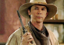Lou Diamond Phillips as Bobby Hattaway, getting a rude reception from Croaker's henchmen in Lone Rider (2008)