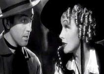 Marlene Dietrich as Frency trying to warn Destry (James Stewart) that he's asking too many questions in Destry Rides Again (1939)