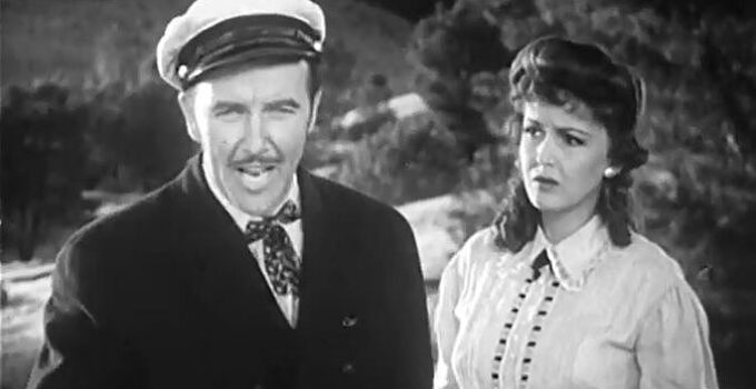 Preston Foster as Paxton Bryce, dreaming of a cattle empire as Abby (Frances Gifford)) looks on in American Empire (1942)