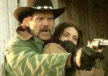 Richard Cutting as Creed Logan, holding Catherine Curry (Kelly Potchak) captive in Come Hell or High Water (2008)