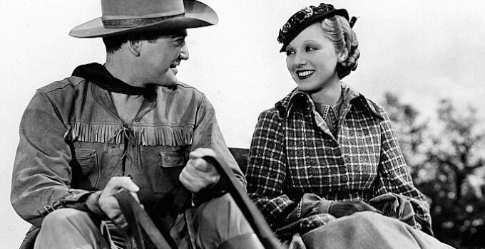 Richard Dix as Bob Culpepper and Leila Hyams as Nellie Brian getting acquainted on a stage ride to town in Yellow Dust (1936)