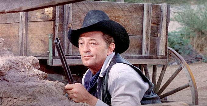 Robert Mitchum as Ben Kane, shooting it out with an old nemesis in Young Billy Young (1969)