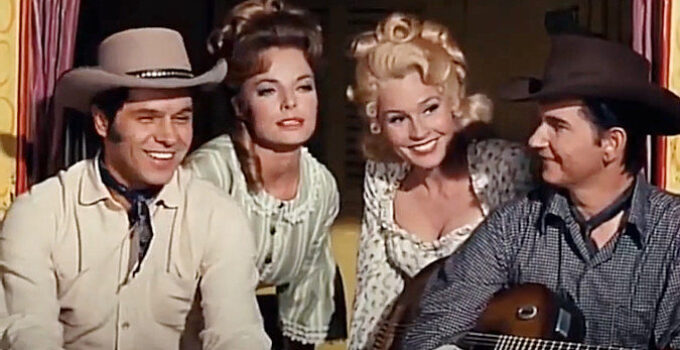 Sammy Jackson as Steve, Joan Freeman as Sue Chesnut, Maggie Pierce as Flo Chesnut and Roy Orbison as Johnny in The Fastest Guitar Alive (1967)