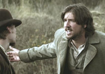 Tanner Beard as James McKinnon, protesting his fate to Kelly (Lou Taylor Pucci) in The Legend of Hell's Gate (2011)