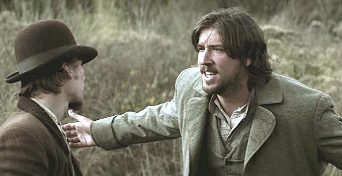 Tanner Beard as James McKinnon, protesting his fate to Kelly (Lou Taylor Pucci) in The Legend of Hell's Gate (2011)