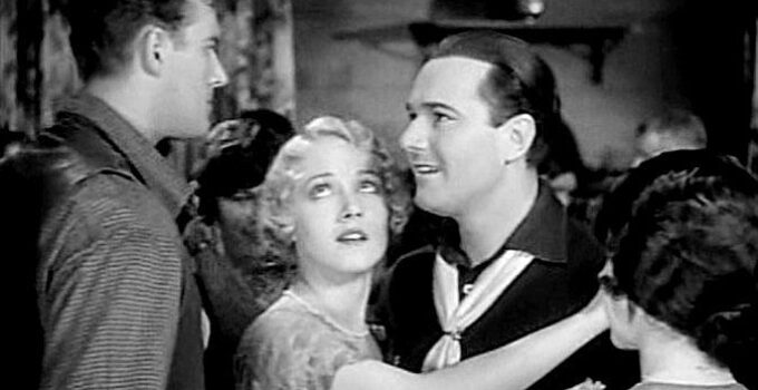 WIlliam Haines as Windy, realizing he's aroused jealousy in Steve (Ralph B ushman) by dancing with Molly (Leila Hyams) in Way Out West (1930)