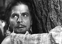 Warner Baxter as Joaquin Murrieta, watching another injustice unfold as he waits to be whipped in Robin Hood of El Dorado (1936)