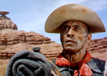 Woody Strode as Sergeant Rutledge, watching an Indian attack on a settler's ranch in Sergeant Rutledge (1960)