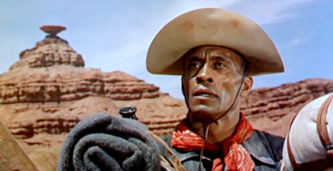 Woody Strode as Sergeant Rutledge, watching an Indian attack on a settler's ranch in Sergeant Rutledge (1960)