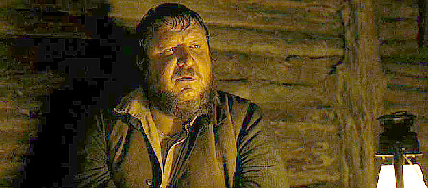 Paul Rae as Emmett Quinc, one of the outlaws hiding in a cabin and found by Rooster Cogburn in True Grit (2010)