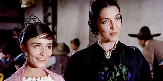 Pina Pellicer as Louisa and Katy Jurado as Maria Longworth, her mother, attending a fiesta in One-Eyed Jacks (1963)