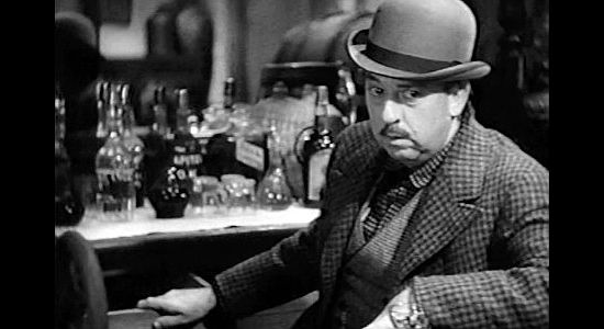 Porter Hall as Jack McCall, watching Wild Bill Hickok play poker in a Deadwood saloon in The Plainsman (1936)