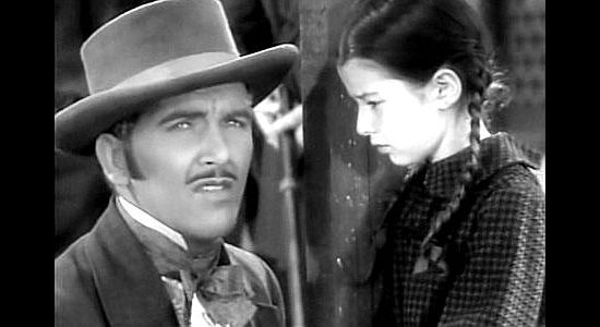 Preston Foster as John Oakhurst and Virginia Weidler as Luck, bidding farewell in The Outcasts of Poker Flat (1937)