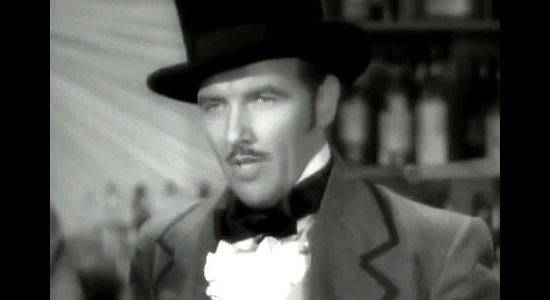 Preston Foster as John Oakhurst, the shrewd businessman who loses his heart to a child and a school teacher in The Outcasts of Poker Flat (1937)