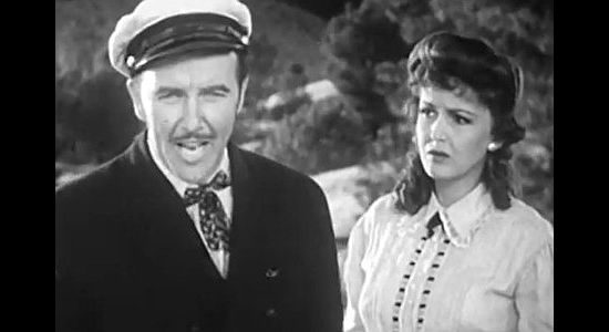 Preston Foster as Paxton Bryce, dreaming of a cattle empire as Abby (Frances Gifford)) looks on in American Empire (1942)