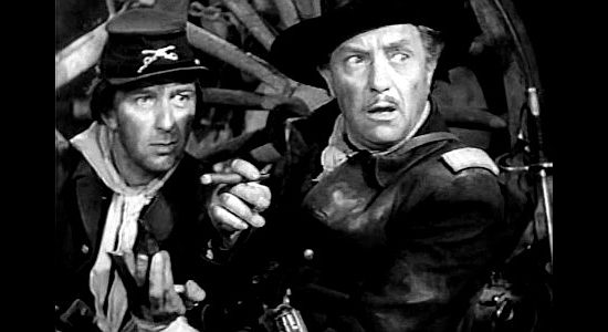 Purnell Pratt (right) as Capt. Wood, learning Calamity Jane has gone for reinforcements in The Plainsman (1936)